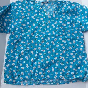 Michael blue scrubs top with daisy print size XL